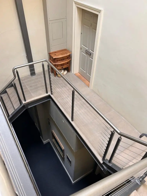 Clean Edinburgh tenement stairway with traditional stone steps